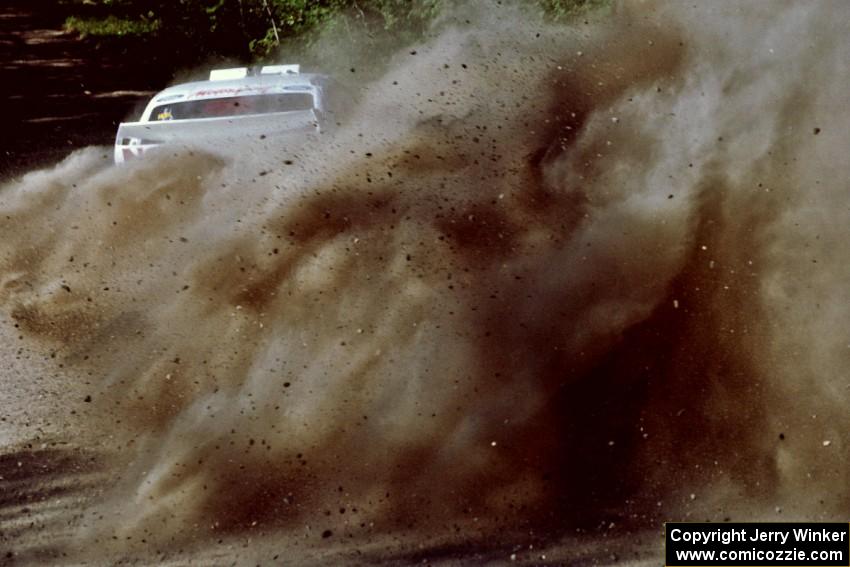 Carl Merrill / Lance Smith Ford Escort Cosworth RS at the spectator point on SS10 (Kabekona).