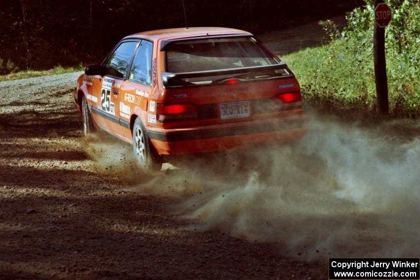 Gail Truess / Pattie Hughes Mazda 323GTX at the spectator point on SS10 (Kabekona).