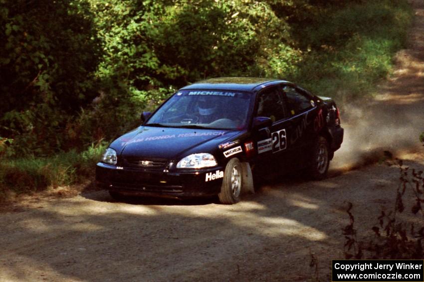 Jay Kowalik / Scott Embree Honda Civic CVT at the spectator point on SS10 (Kabekona).