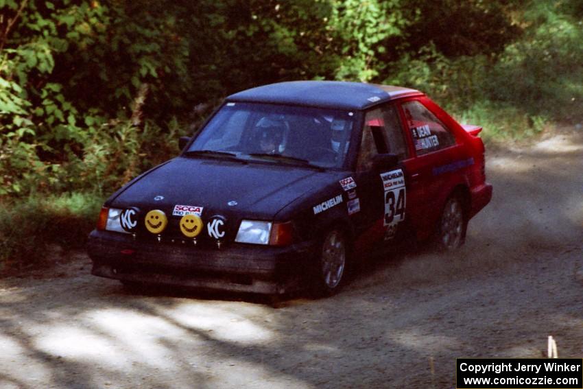 Rod Dean / Nichole Hunter Ford Escort GT at the spectator point on SS10 (Kabekona).