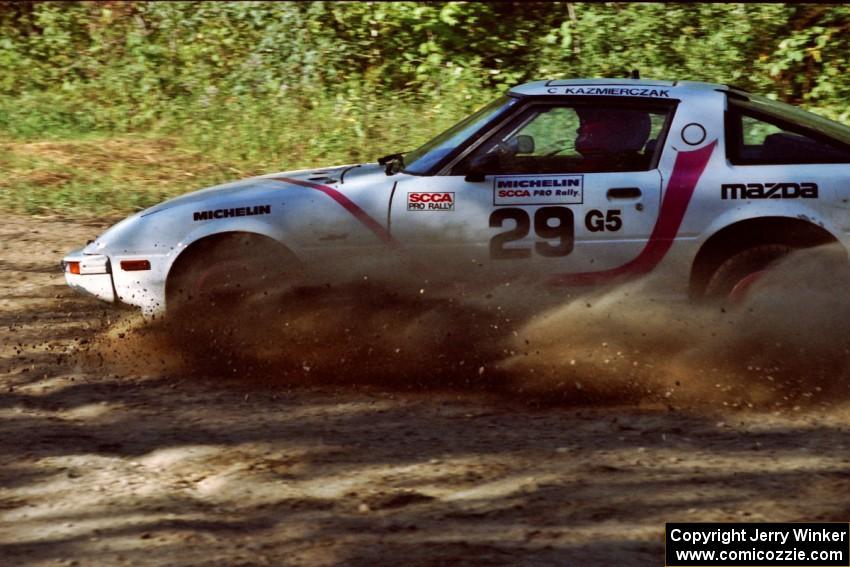 Craig Kazmierczak / Diane Sargent Mazda RX-7 slides to a near stop at the spectator point on SS10 (Kabekona).