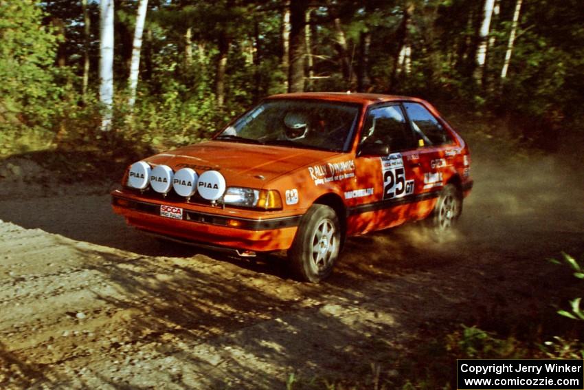 Gail Truess / Pattie Hughes Mazda 323GTX at speed on SS12 (Parkway).