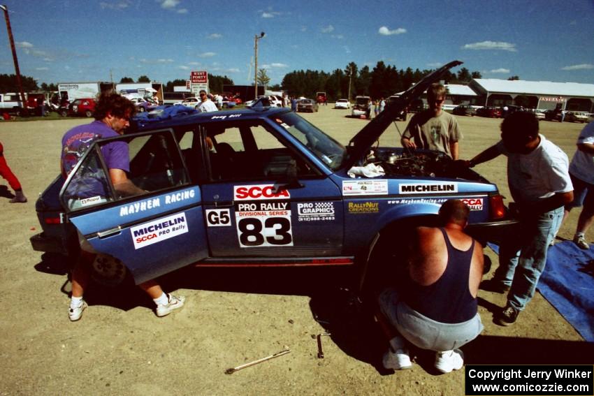 Crew members swarm around the Mark Utecht / Doug Dill Dodge Omni GLH-Turbo at Park Rapids service.