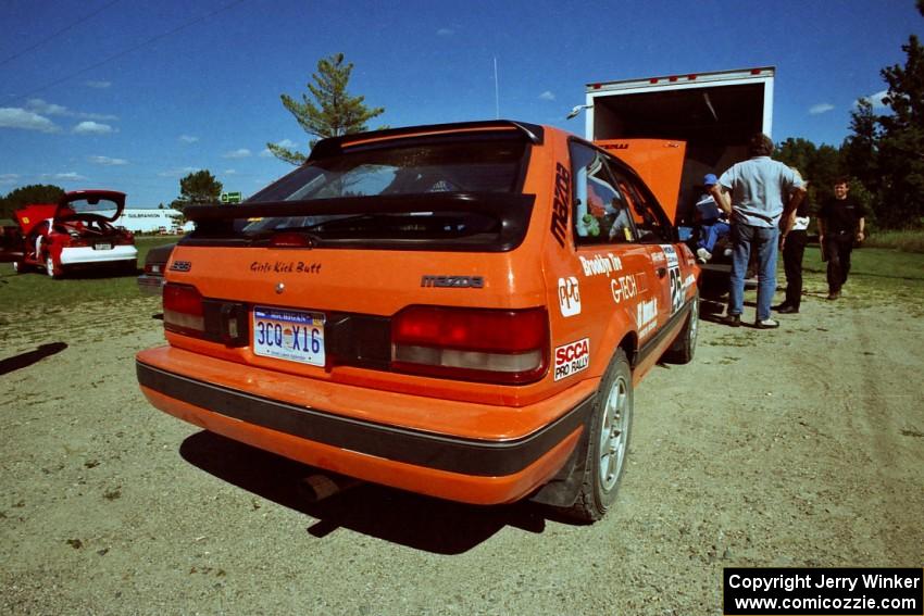 Gail Truess / Pattie Hughes Mazda 323GTX gets serviced at the West Forty in Park Rapids on day two.