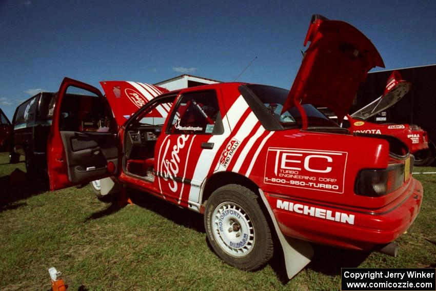 Mike Whitman / Paula Gibeault Ford Sierra Cosworth gets serviced at the West Forty in Park Rapids on day two.