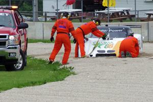 Mark Wilkins / Burt Frisselle Riley XI/BMW is pulled from the turn 14 gravel trap