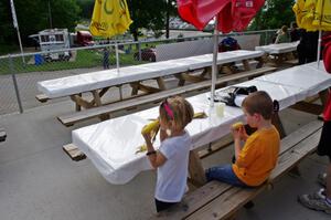 Grabbing an ear of corn while cars are on their recon laps.