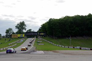 The field heads uphill from turn 5 on the pace lap.