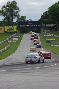 The field heads uphill from turn 5 on the pace lap.