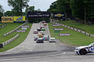 Charles Espenlaub / Charlie Putman BMW M3 Coupe waits as the GS field heads uphill from turn 5 on the first lap.