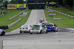 The ST field heads uphill from turn 5 on the first lap.