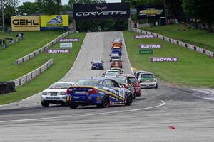 The ST field heads uphill from turn 5 on the first lap.