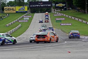 The ST field heads uphill from turn 5 on the first lap.