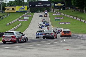 The ST field heads uphill from turn 5 on the first lap.