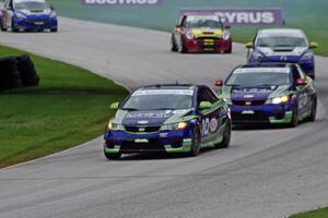 Mike Galati / Nic Jonsson and Adam Burrows / Trevor Hopwood KIA Forte Koups lead the other ST cars