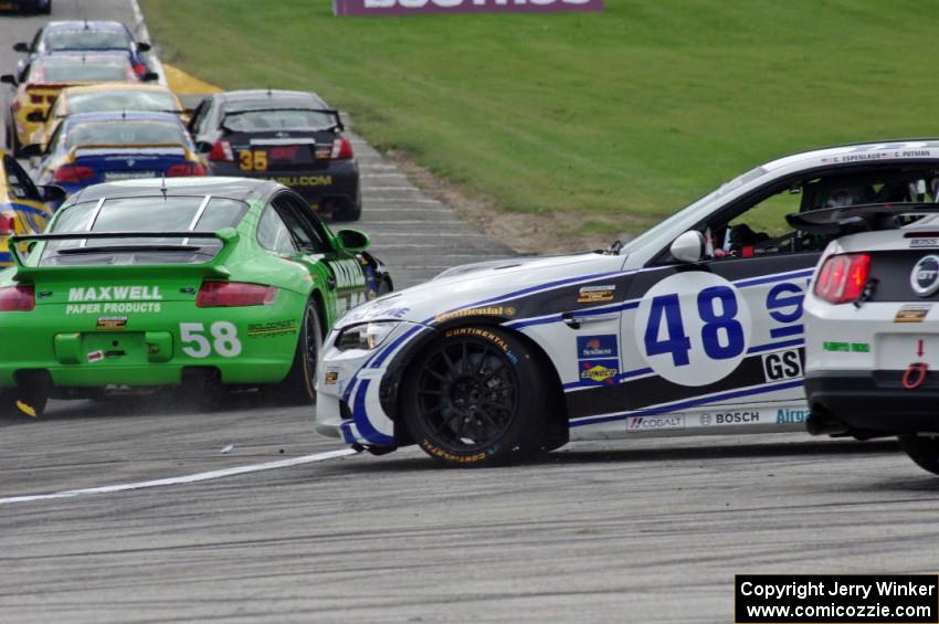 Charles Espenlaub / Charlie Putman BMW M3 Coupe waits as the GS field heads uphill from turn 5 on the first lap.