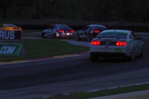 Four GS cars battle through turn six just before sundown.