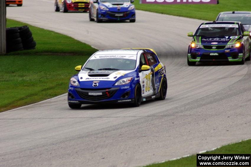 Taylor Hacquard / Pierre Kleinubing Mazda Speed 3 and Mike Galati / Nic Jonsson KIA Forte Koup ahead of other ST cars