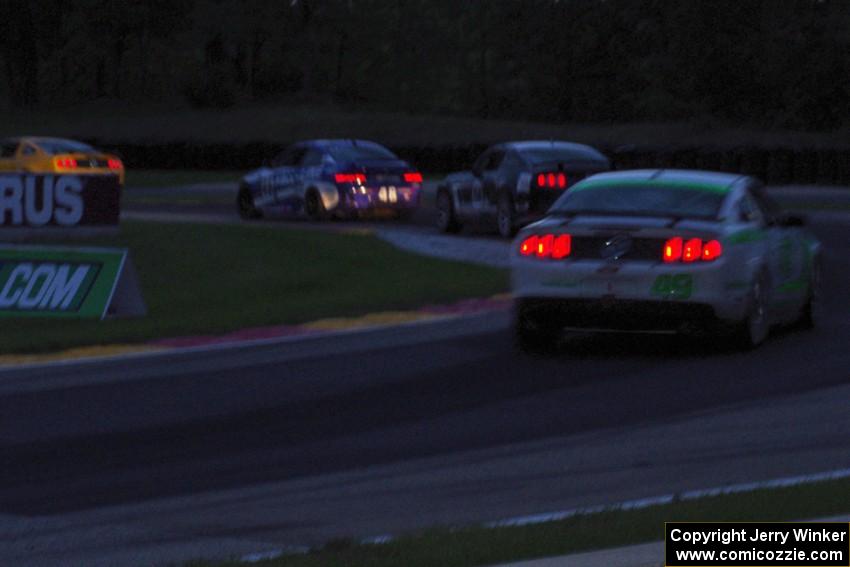 Four GS cars battle through turn six just before sundown.