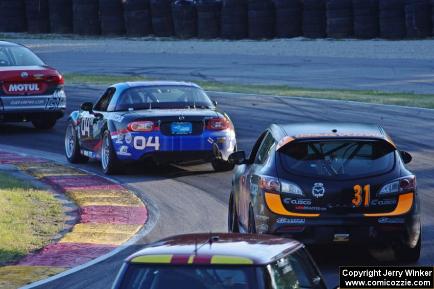 Juan Alvarez / Juan Sierra Lendle VW Jetta, Marc Miller's Mazda MX-5 and Pierre Kleinubing / David Knight Mazda Speed 3