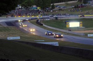 The ST field comes through turn 5 on the cool off lap well after sundown.