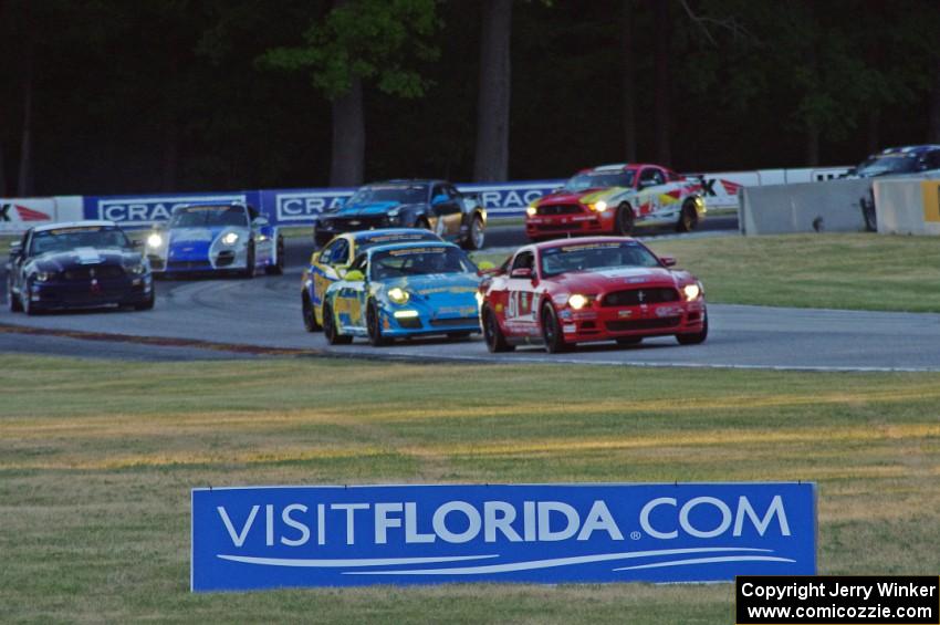 Cars resume racing and come out of turn 6.