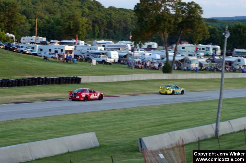 Nick Longhi / Matt Plumb Porsche 997 leads Billy Johnson / Jack Roush, Jr. Mustang Boss 302R GT