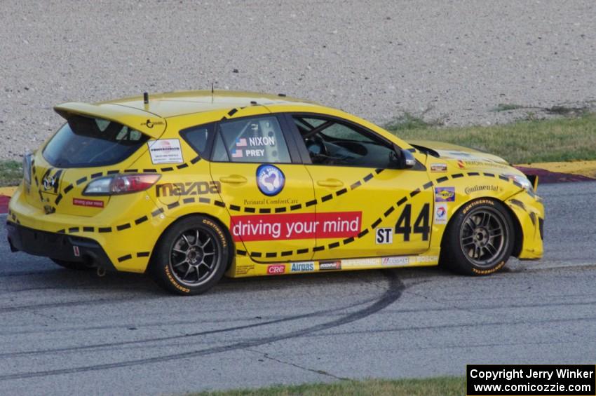 Gareth Nixon / Chris Prey Mazda Speed 3 is motionless in turn 7 after wrecking