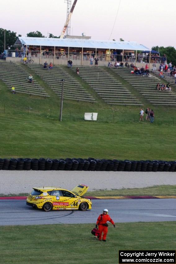 Gareth Nixon / Chris Prey Mazda Speed 3 is motionless in turn 7 after wrecking