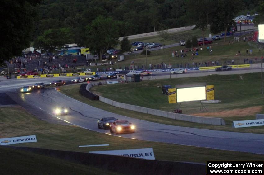 The GS field comes through turn 5 on the cool off lap well after sundown.