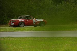 Penalty Lap Racing Mazda Miata pulls off at the carousel mid-race