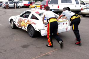 Team Polska Kielbasa Nissan 280ZX gets a push start in the paddock mid-race