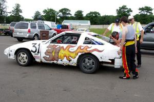 Team Polska Kielbasa Nissan 280ZX in the paddock mid-race