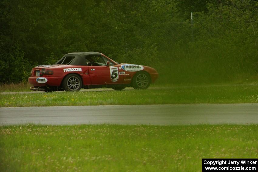 Penalty Lap Racing Mazda Miata pulls off at the carousel mid-race