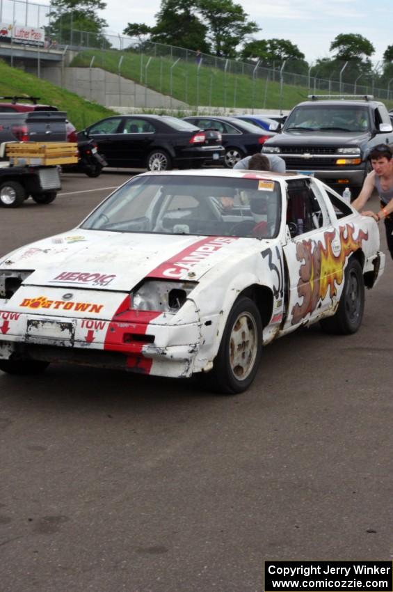 Team Polska Kielbasa Nissan 280ZX in the paddock mid-race