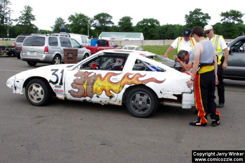 Team Polska Kielbasa Nissan 280ZX in the paddock mid-race