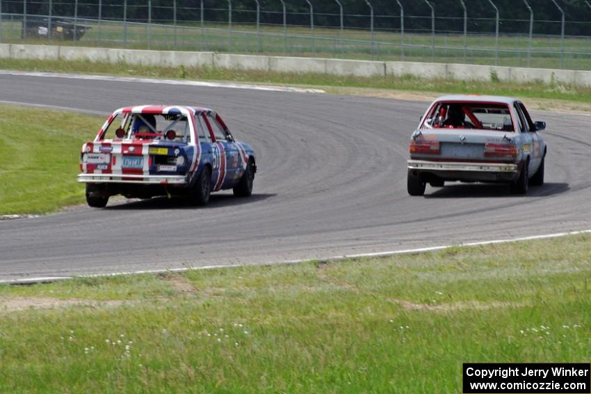 British American Racing BMW 318i passes the North Loop Motorsports 2 BMW 325