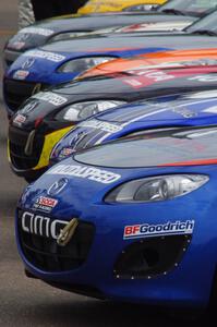 Mazda MX-5s lined up for Saturday morning practice