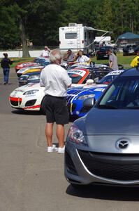 Photographer Mark Weber plans a shot of the line of Mazda MX-5s before they head out