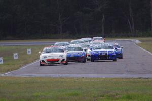 Playboy Mazda MX-5 Cup cars come into turn 4 on the first lap