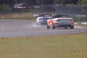 Dean Copeland's Mazda MX-5 drifts through turn 6 on the cool-off lap