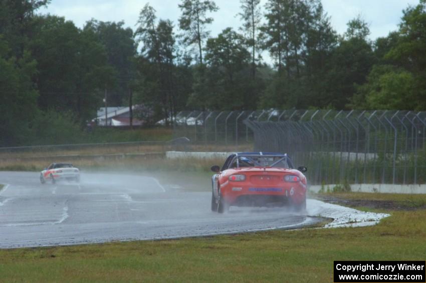 Michael Cooper chases down Dean Copeland's Mazda MX-5