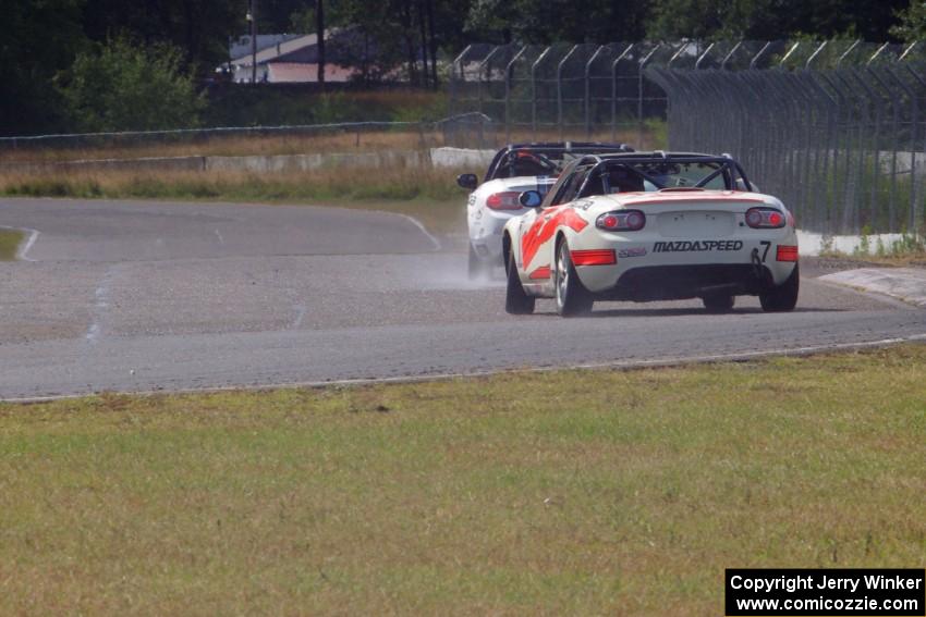 Dean Copeland's Mazda MX-5 drifts through turn 6 on the cool-off lap