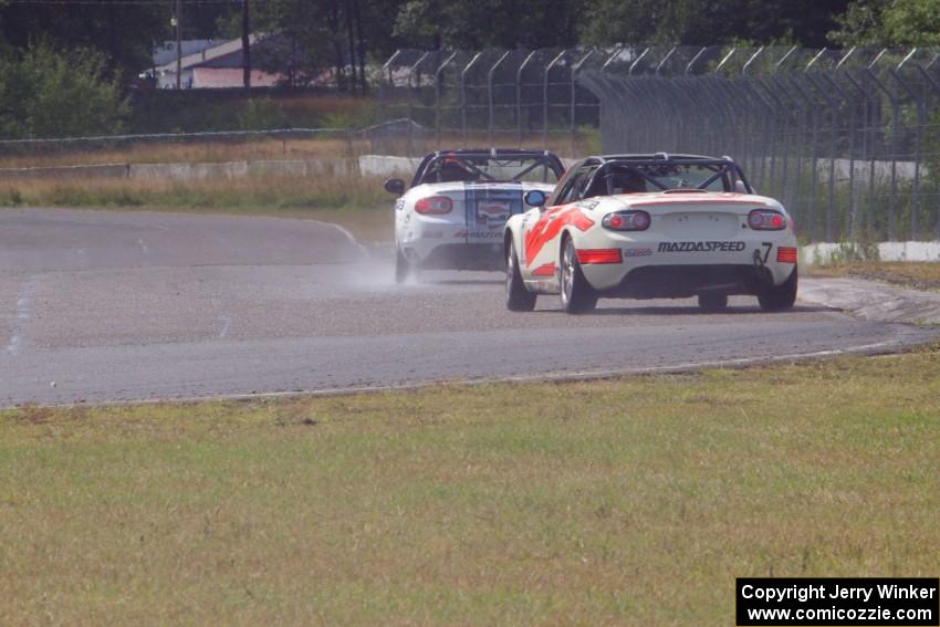 Dean Copeland's Mazda MX-5 drifts through turn 6 on the cool-off lap