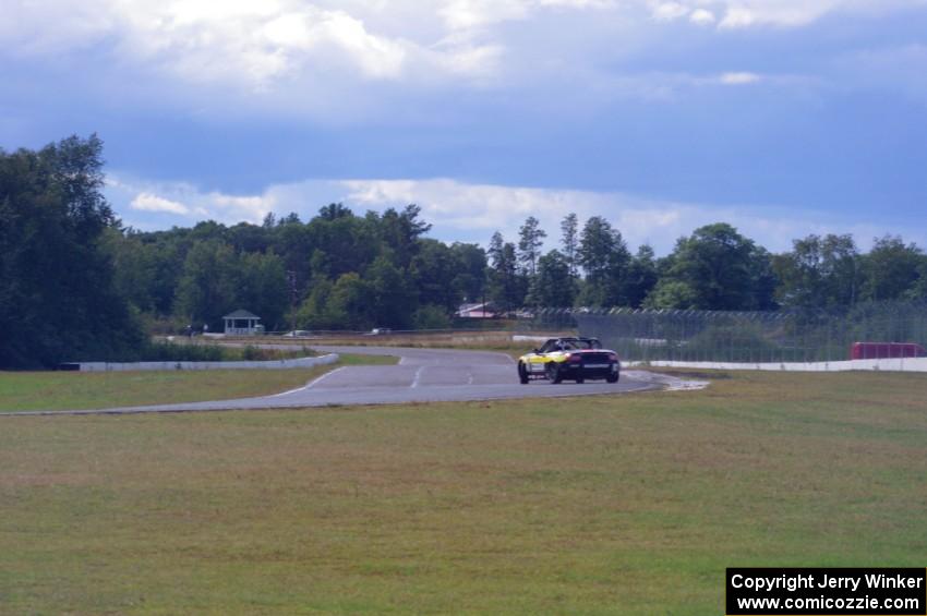 Jeff Mosing's Mazda MX-5 drifts through turn 6 on the cool-off lap