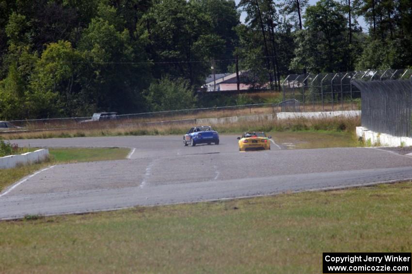Scott Shelton's and Tim Probert's Mazda MX-5s head into turns 7/8 on the cool-off lap