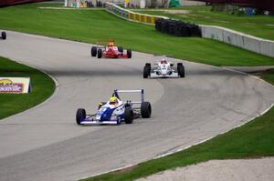 (8) Spencer Pigot leads (3) Petri Suvanto and (4) Wayne Boyd as the rain starts