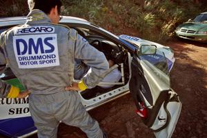 The Hiroyuki Genta / Kazmasa Takata Subaru Impreza gets last minute prep before the start of the rally.