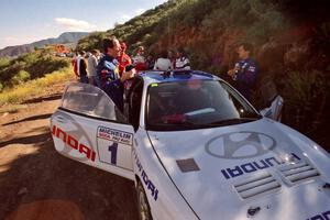 Paul Choinere / Jeff Becker plan strategy before the start of SS1 in their Hyundai Tiburon.