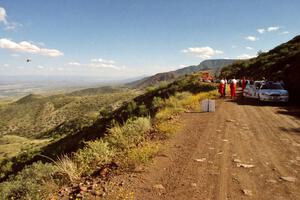 A helicopter carrying ESPN2 cameraman Doug Plumer passes the cars and drivers awaiting the stage start.